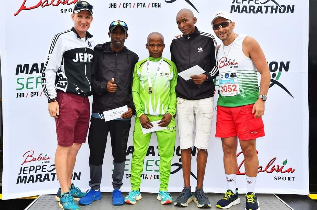 Prize-giving on the podium at the Jeppe Marathon