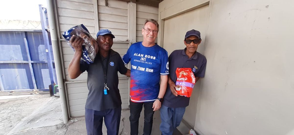 Callies member handing over SPCA donations